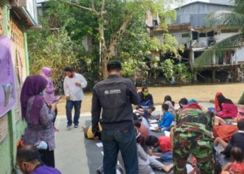Gandeng Sejumlah Lembaga, ‘Aisyiyah Sumut Gembirakan Warga Korban Banjir di Bantaran Sungai Deli